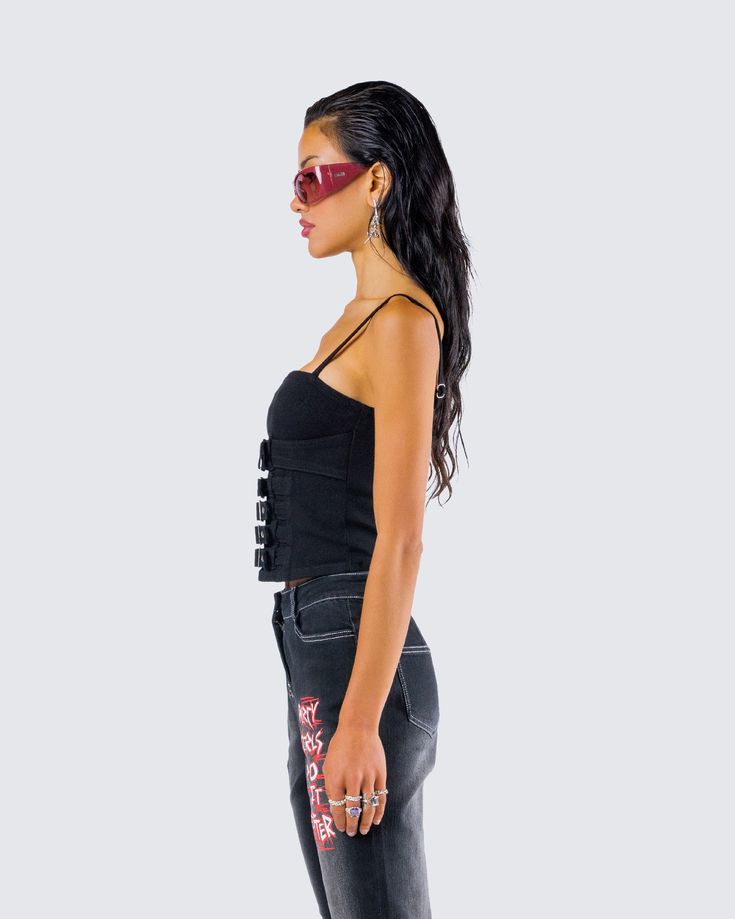 Buckle up, babe 🖤 Prepare for the ride of a lifetime in this black buckle top made from denim fabric for an edgy look perfect for all of our trouble makers 😈 Fitted Denim Top For Night Out, Edgy Cotton Crop Top For Night Out, Black Rebellious Streetwear Tops, Trendy Fitted Denim Top For Night Out, Fitted Trendy Denim Top For Night Out, Edgy Cotton Tank Top For Night Out, Edgy Black Crop Top For Concert, Trendy Black Denim Top For Spring, Black Denim Top For Summer