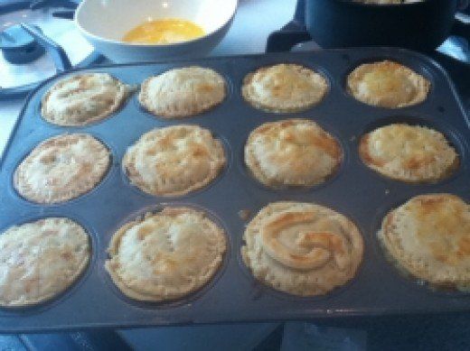 muffins in a pan on the stove ready to be baked