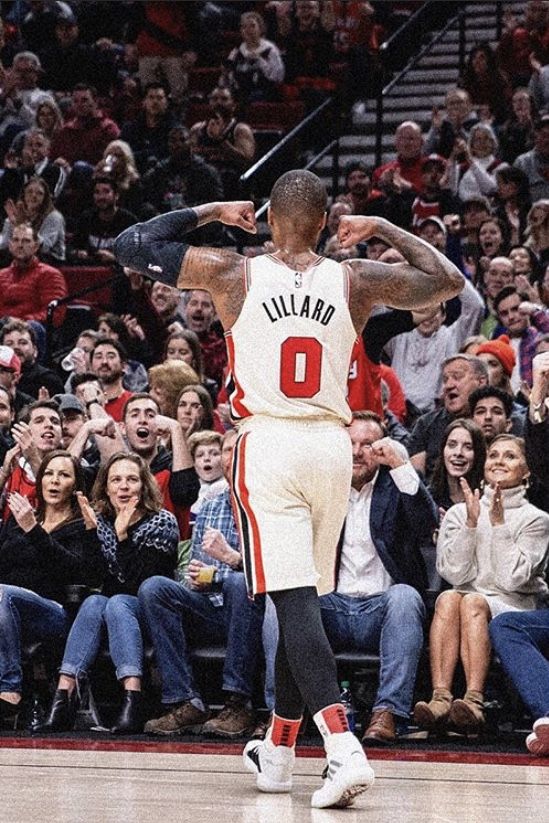 a basketball player is standing in front of an audience