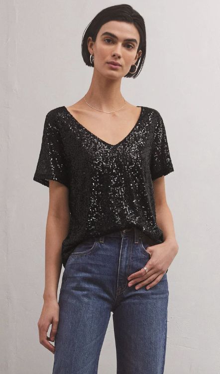 Looking for that wow factor? The fully lined v-neck Marbella Sequin Top has you covered. Able to be worn tucked or untucked, this relaxed, sparkly Stretch Satin Top will add dimension to your casual or elevated look, and we love it with denim. Relaxed fit True to size Stretch Sequin: 92% Polyester, 8% Spandex V necklin Mens Trunks, Girls Together, Shopping Event, Cropped Denim Jacket, Wow Factor, Trend Forecasting, Satin Top, Stretch Satin, Sequin Top