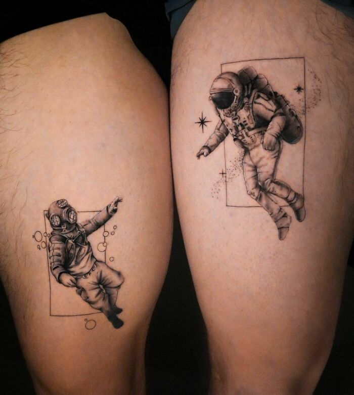 two people with tattoos on their legs, one has an astronaut and the other is a man