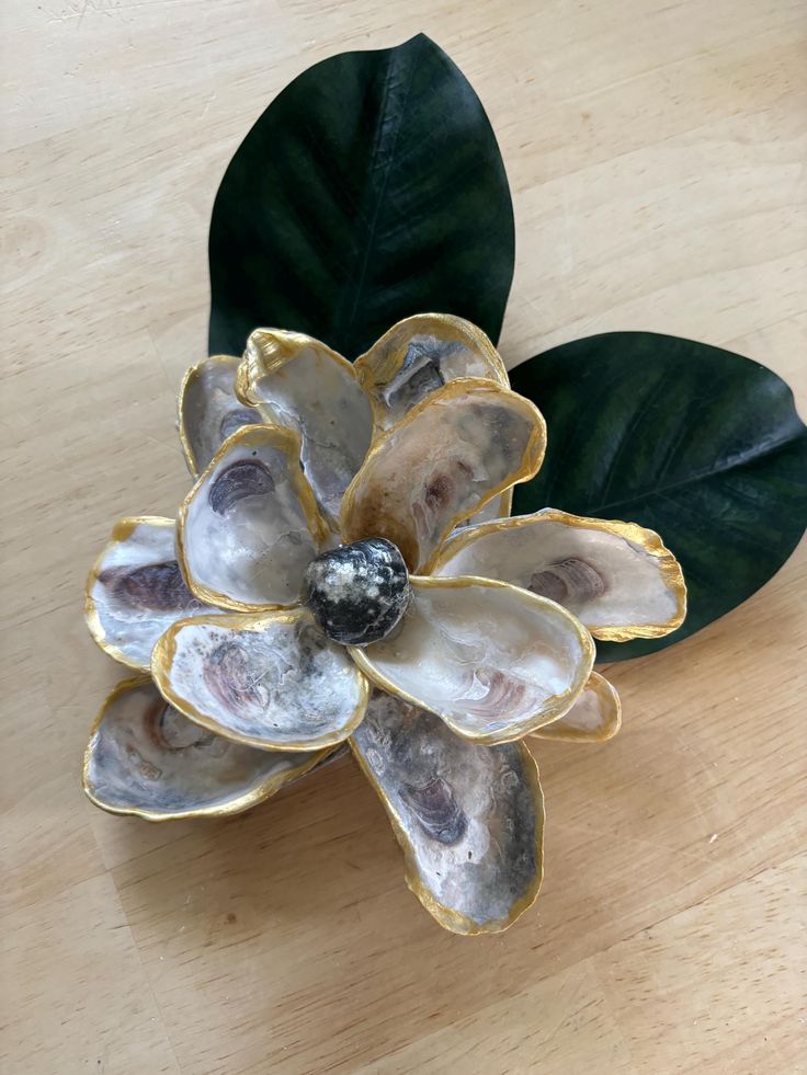 a flower shaped object sitting on top of a wooden table