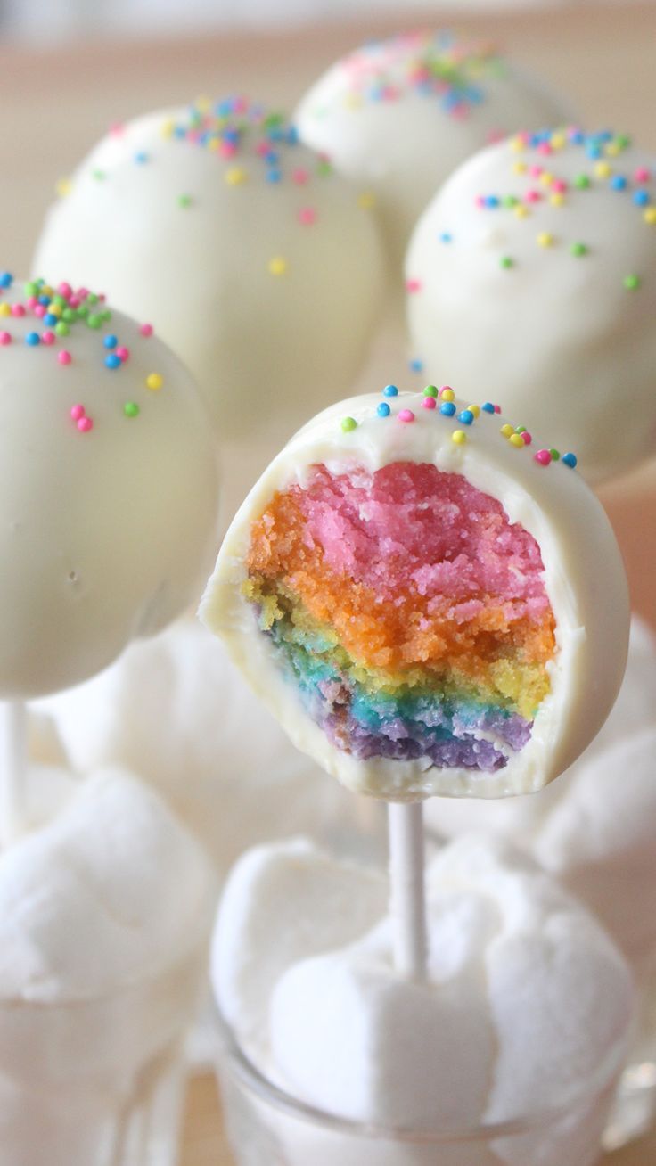 the cake pops are covered in rainbow sprinkles