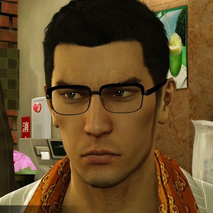 a man with glasses and a scarf around his neck