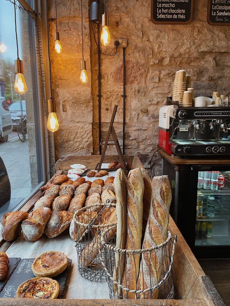 breads and pastries on display in a bakery