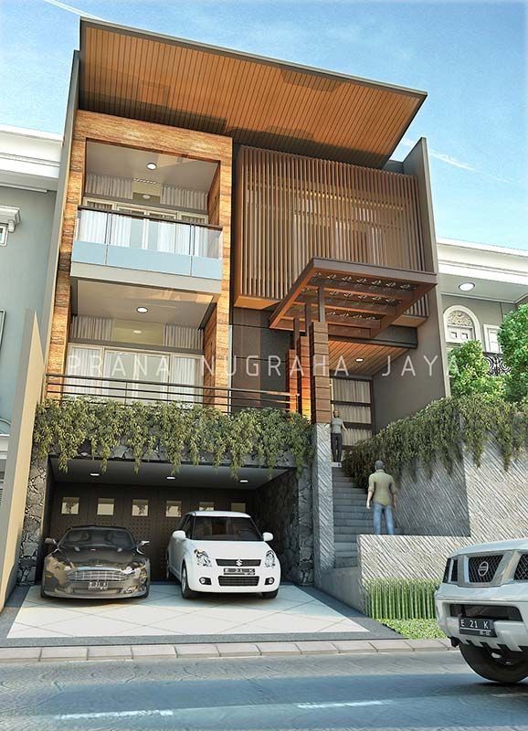 two cars parked in front of a building with balconies on the second floor