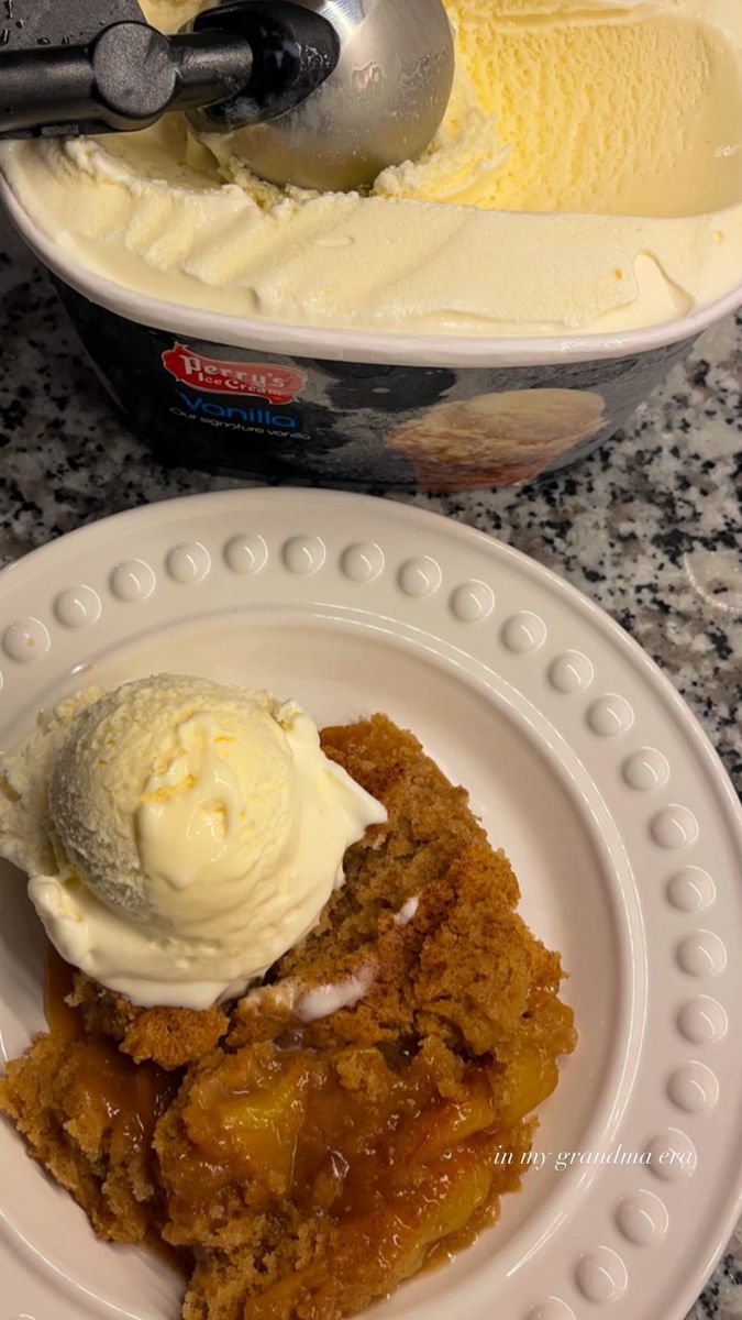 two white plates topped with dessert and ice cream