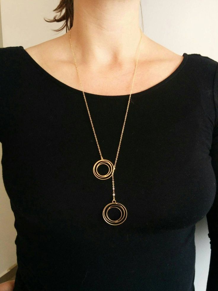 Unique Long Golden Pendant Necklace, with circle design, on a gold filled necklace Matte finished design. Made of 24k gold plated brass base.  Dimensions:  Length:                 1.2 inch       3 cm  Width:                         0.8 inch      2 cm Thickness:                1/32 inch   0.7mm Necklace length       32 inch     80 cm Item will be shipped in a branded gift box. Complete the look with the matching Golden circle Earrings. To view matching earrings click here: https://www.etsy.com/il Metal Necklace Full Circle For Gift, Metal Full Circle Necklace For Gift, Modern Gold Lariat Necklace, Modern Gold Metal Lariat Necklace, Gold Necklaces With Delicate Open Circle Chain, Gold Plated Circle Necklace With Adjustable Chain, Gold-tone Plated Chain Necklace With Round Pendant, Gold Full Circle Necklaces With Adjustable Chain, Gold Full Circle Necklace With Adjustable Chain