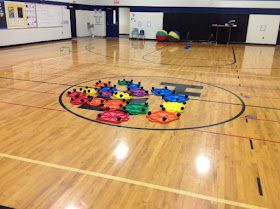 an empty gym with toys on the floor