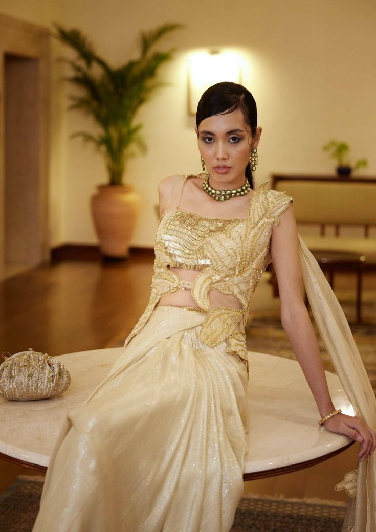 Kaya Sari Gold Pre-draped Saree With Resham Embroidery For Reception, Embellished Chanderi Pre-draped Saree, Festive Gold Embellished Pre-draped Saree, Reception Blouse Piece With Sheer Dupatta In Tissue Silk, Traditional Embellished Pre-draped Saree In Raw Silk, Glamorous Pre-draped Saree With Resham Embroidery For Reception, Gold Organza Pre-draped Saree With Resham Embroidery, Traditional Embellished Tissue Silk Pre-draped Saree, Festive Gold Pre-draped Saree With Sequins