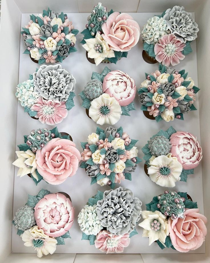 a box filled with cupcakes covered in frosting