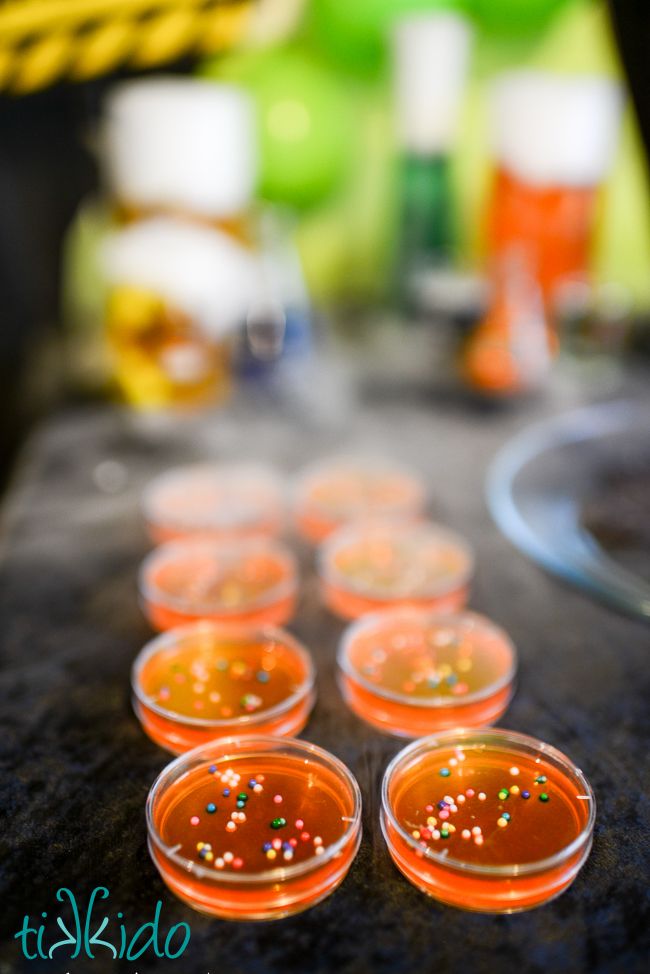 small plastic cups filled with liquid and sprinkles