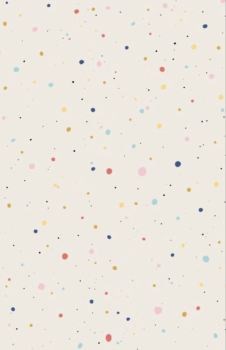 a white wall with multicolored dots on it