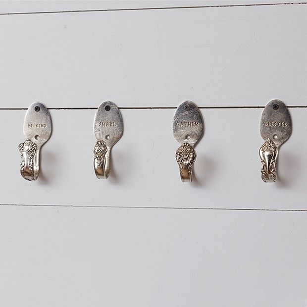 five birds are hanging on the wall next to each other