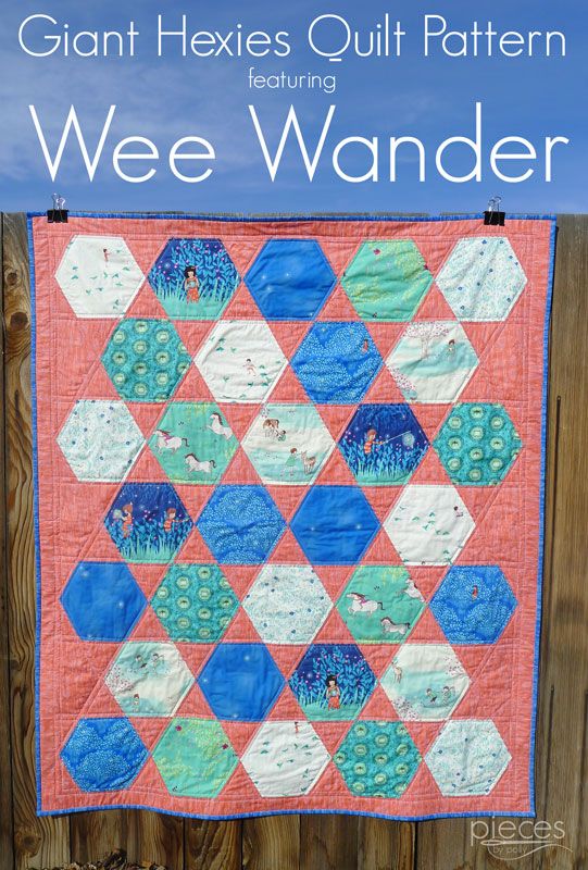 the giant hexies quilt pattern is hanging on a fence with text overlay that reads giant hexies quilt pattern featuring wee wanderr