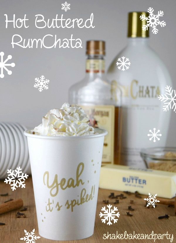 a cup filled with whipped cream next to bottles of rumchata and cinnamon sticks