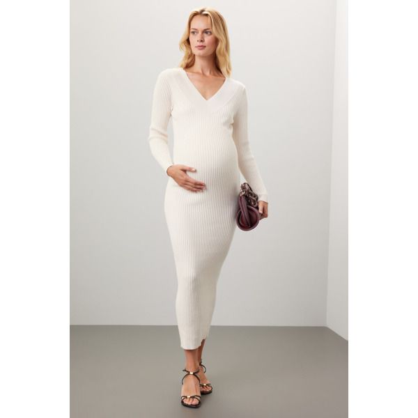 Off-white knit (48% Viscose, 27% Polyamide, 20% Polyester, 5% Wool). Sweater sheath. Long sleeves. V-neck. Pull on. 52" from shoulder to hemline. Imported. Cream Fitted V-neck Sweater Dress, Elegant V-neck Bodycon Sweater Dress, Elegant Knit Bodycon Dress, Elegant White V-neck Dress For Fall, Elegant Cream V-neck Sweater Dress, White V-neck Midi Dress For Winter, Elegant Ribbed V-neck Bodycon Dress, Chic White Knit Midi Dress, White Knit Bodycon Sweater Dress