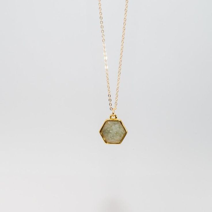 Hexagon shaped gemlets are electroplated in recycled brass with 24K gold overlay and hang delicately from a 14K gold filled 18" chain. 10mm Stone. Offered in a variety of stones that embrace and emit healing properties. Check out a stone encyclopedia here. Gold Crystal Healing Necklaces 14k Gold Filled, Dainty Gold Necklace With Raw Stone, Gold Hexagon Faceted Necklace, Gold Necklaces With Gemstones In 14k Gold Filled, Minimalist Gold Hexagon Necklace, Dainty Gold Faceted Crystal Necklace, Dainty Gold Faceted Crystal Necklaces, Hexagon 14k Gold Necklace Gift, Gold Octagon Birthstone Jewelry