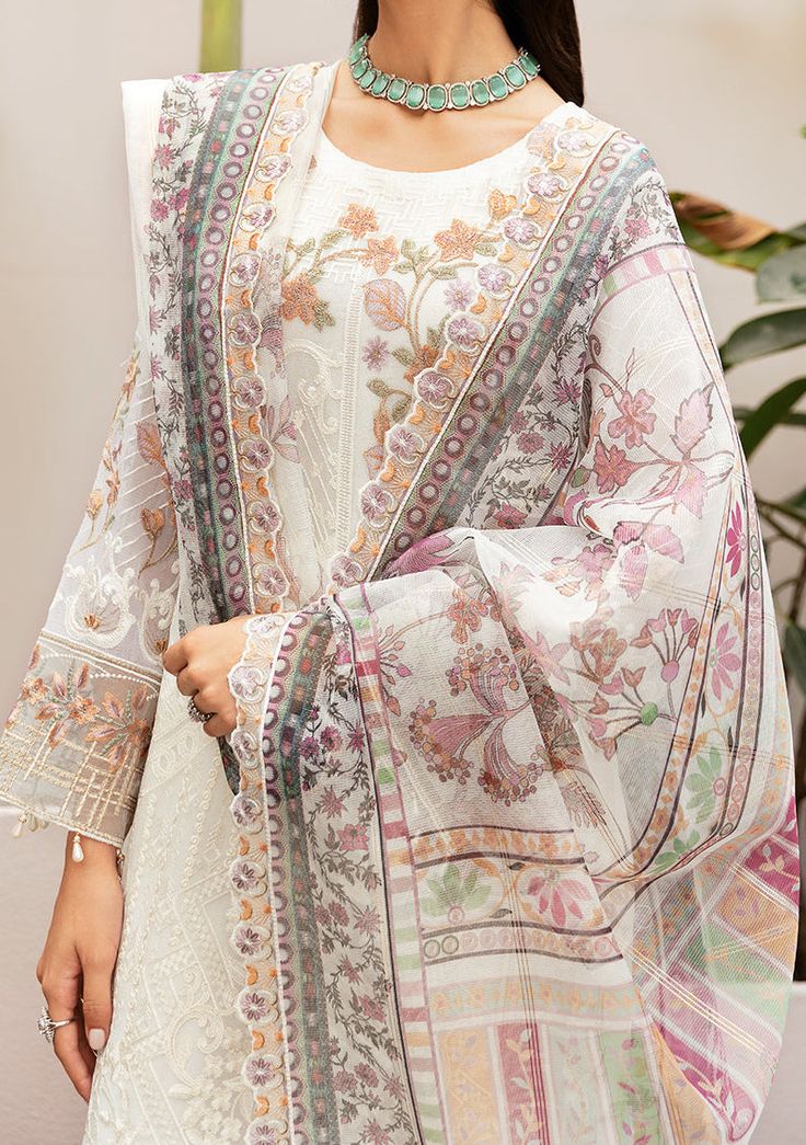 Introducing our Chiffon collection DASTAN by Ramsha designed to make you look and feel your best These pieces will add a touch of class and elegance to your wardrobe. This collection is a beautiful collection of ensembles offering versatile compositions for the latest festive wardrobe requirements. Embroidered Chiffon Front With Sequence. Embroidered Chiffon Back and Sleeves. Embroidered Organza Lace. Embroidered Organza Ghera, and Trouser Lace. Digital printed Dupatta. Raw Silk Trouser. Color: There might be slight color variation due to lighting and flashes while the photo shooting. The color may also vary because of different screen resolutions. Wash Care: Dry Clean Only. Bohemian Kurta With Dupatta In Georgette, Bohemian Georgette Kurta With Dupatta, Summer Dresses With Traditional Drape And Printed Motifs, Designer White Dupatta With Printed Motifs, White Chanderi Dress For Spring, Elegant Silk Chiffon Sets With Dupatta, Spring White Chanderi Dress, White Bohemian Designer Dupatta, Elegant Silk Chiffon Sets For Festive Occasions