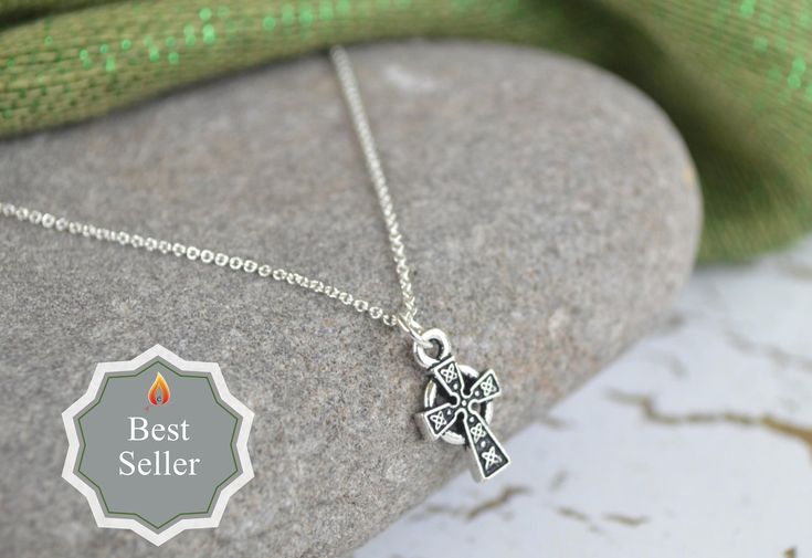 Just a simple, elegant touch of Celtic style in this Irish Celtic Cross Necklace. A perfect necklace for anyone, and especially those who love Ireland and want to wear a bit of Celtic history. Perfect for youth, or someone who prefers a smaller, petite, classic style. **Size: The cross itself is about 5/8 of an inch and almost hangs at 3/4 of an inch when on the jump ring attached to the chain. In millimeters, the cross is 15mm long and 9mm wide. Please see the second photo for a reference of th Nickel-free Cross Pendant Necklace As Gift, Classic Cross Necklaces For Gifts, Classic Cross Necklace As A Gift, Nickel Free Cross Charm Necklaces As Gift, Nickel Free Cross Pendant Charm Necklace As Gift, Nickel-free Cross Charm Necklaces As Gift, Classic Nickel-free Charm Necklaces As A Gift, Classic Nickel-free Charm Necklaces For Gifts, Classic Nickel-free Charm Necklace For Gift