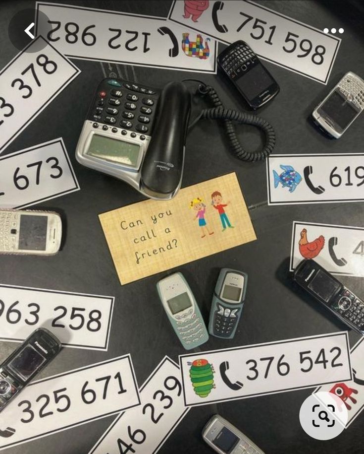 there are many cell phones on the table with numbers and signs around them that read can you call friends?