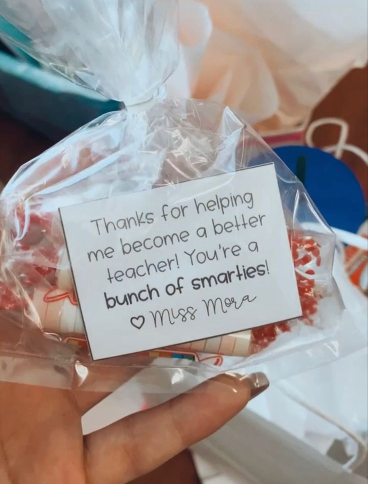 a person holding a bag filled with lots of candy