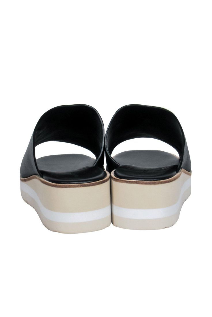 Slip on some easy and breezy summer style with these Vince sandals! The classic slide sandal is elevated (literally!) with a chic striped wedge and platform. Perfect for all your warm weather excursions! Whether you're headed to a post-beach dinner or going shopping downtown with your BFFs, pair these beauties with a maxi dress and your favorite sunnies and you'll be good to go! Size 9 Leather upper Slip on Open back Open toe Striped platform and wedge Leather sole and footbed w/ almost no wear Modern Slip-on Clogs For Summer, Comfortable Summer Slides With Wedge Heel, Open Toe Platform Slip-on Slides, Platform Slip-on Slide Sandals, Slip-on Platform Slide Sandals, Summer Platform Slide Slippers, Casual Slip-on Platform Slides, Summer Slip-on Synthetic Clogs, Summer Platform Open Toe Slides