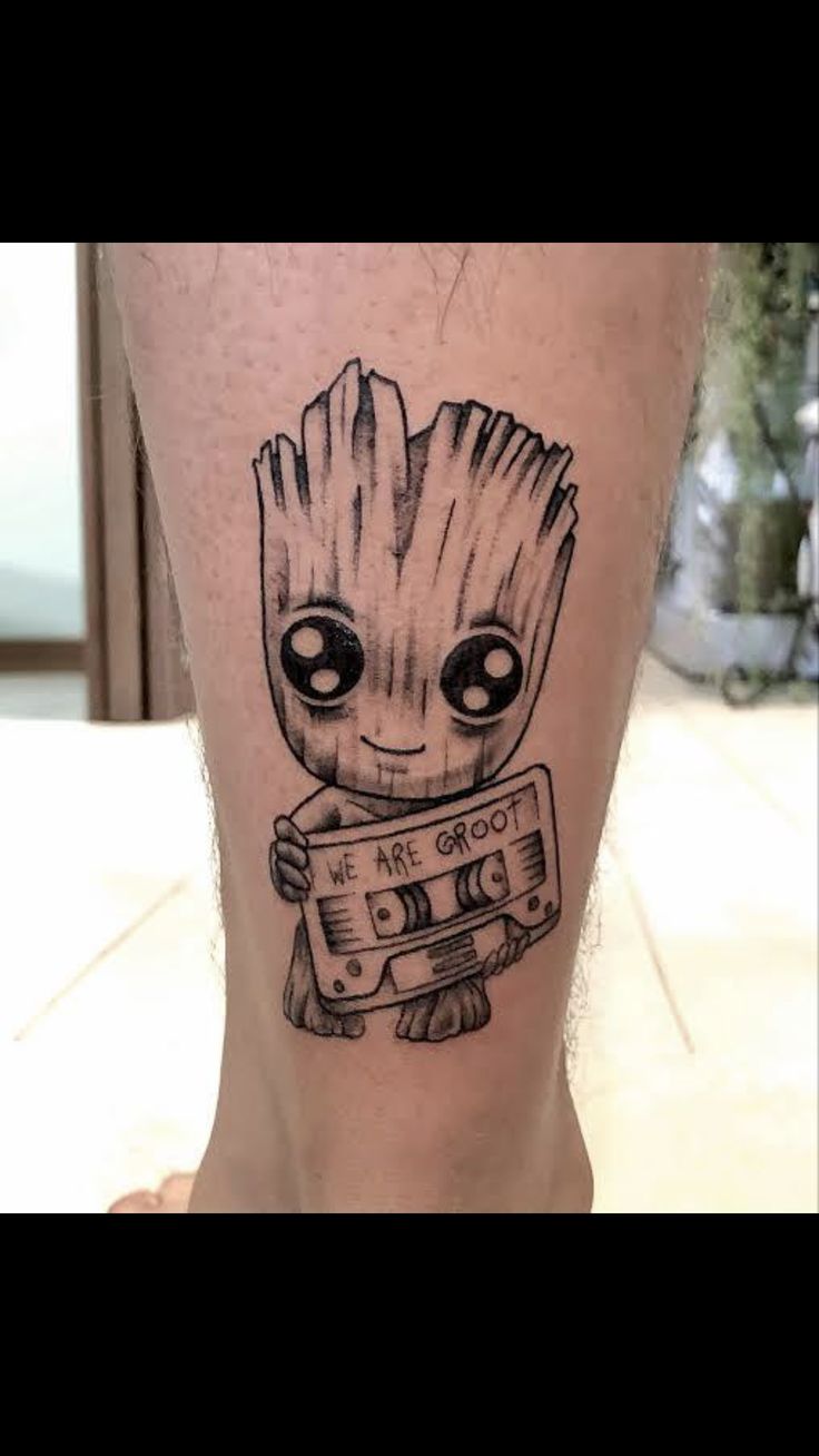 a small tattoo on the leg of a person with an old school style boombox