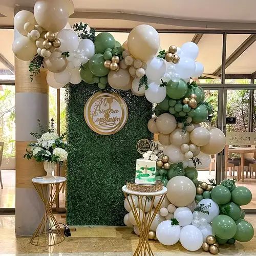 the balloon arch is decorated with green, white and gold balloons for an elegant celebration