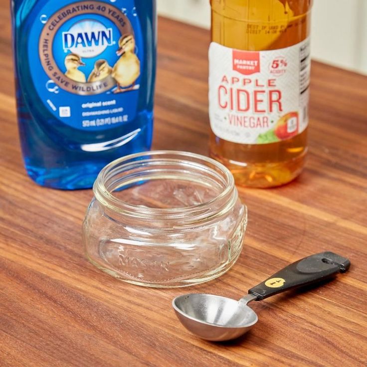 the ingredients for apple cider are sitting on the counter next to an empty glass jar