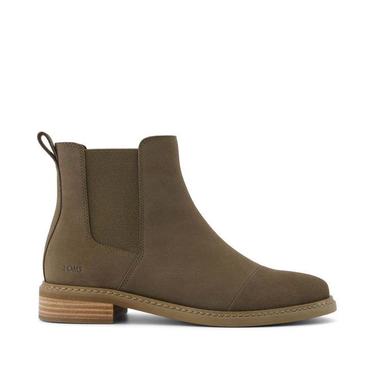 The Chelsea boot that gives back. With a classic silhouette, canteen-green Nubuck leather uppers and CloudBound™ insoles, the Charlie ankle boot brings a classic and comfortable look to any outfit—from slacks and jeans to skirts and dresses. Nubuck leather uppers. TOMS leather products support responsible manufacturing via the Leather Working Group. Non-removable Custom CloudBound™ foam insoles for all-day comfort and support. Dual gore for easy on and off. German sole forefoot and rubber heel. Stacked leather-wrapped heel. TPR Welt: A lightweight rubber that’s durable, flexible and provides traction. with stitch. Heel height is approximately 3/4". Shaft height is approximately 5”. TOMS is a proud member of the Fair Labor Association—working with suppliers that conduct their businesses eth Ankle Boots With Leggings, Leather Wear, Womens Toms, Toms Shoes, Nubuck Leather, Rubber Heels, Boot Shoes Women, Green And Brown, Leather Working