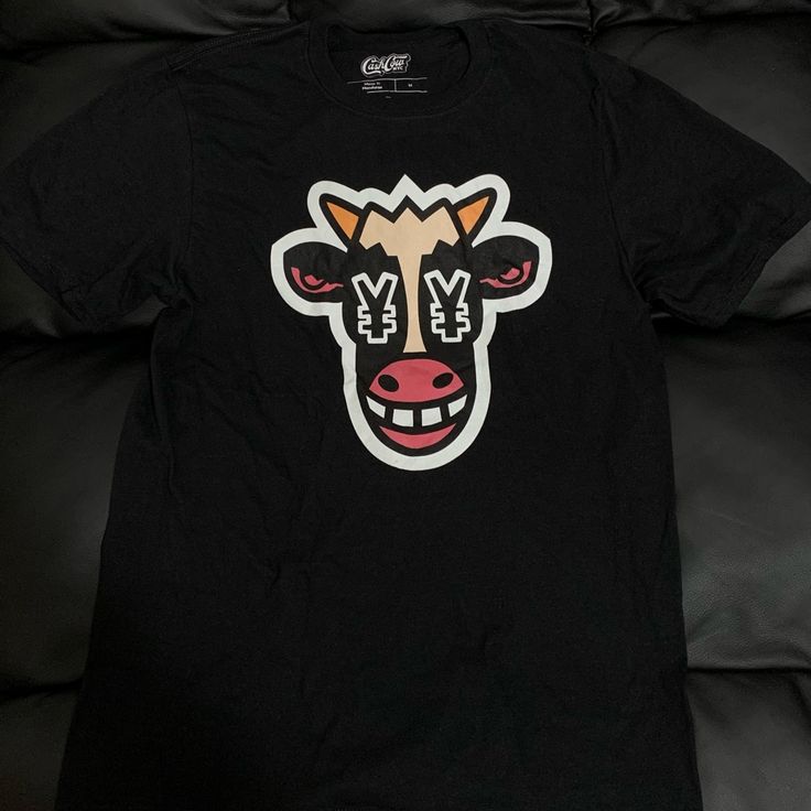 Cash Cow T-Shirt Brand New Men’s Medium Black Fan Apparel T-shirt With Logo Print, Black Fan Apparel T-shirt With Graphic Design, Urban Black Shirt For Fan Merchandise, Black Fan Apparel Shirt With Logo Print, Black Logo Print Shirt For Fans, Black Shirt With Logo Print For Fans, Casual Black T-shirt With Front Print, Casual Black Shirt For Fan Merchandise, Cow Print Shirt