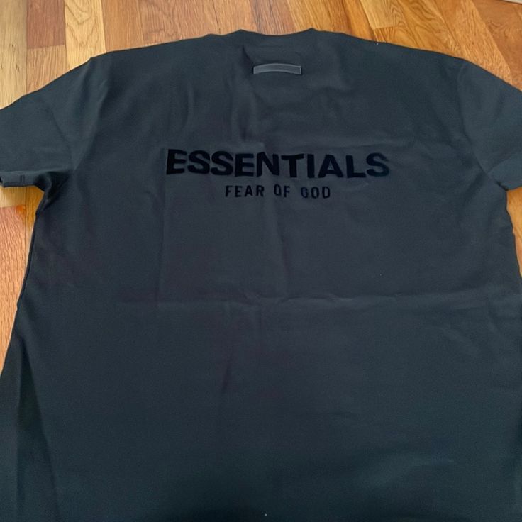 Essentials Black New T-Shirt Size Small Essential Shirts For Men, Black Essential T-shirt With Relaxed Fit, Basic Black T-shirt For Streetwear, Black Crew Neck T-shirt With Logo, Urban Black T-shirt With Logo, Black Urban T-shirt With Logo, Essential Black Crew Neck T-shirt, Essential Short Sleeve T-shirt With Logo Print, Urban Short Sleeve Top With Logo