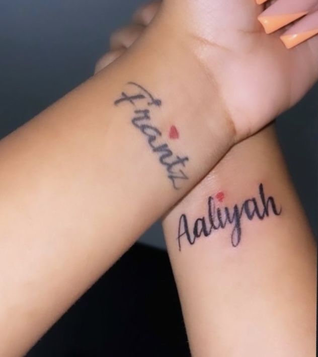 two people with tattoos on their arms that say happy aaliyann and have hearts