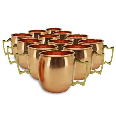 a set of six copper colored cups sitting on top of each other