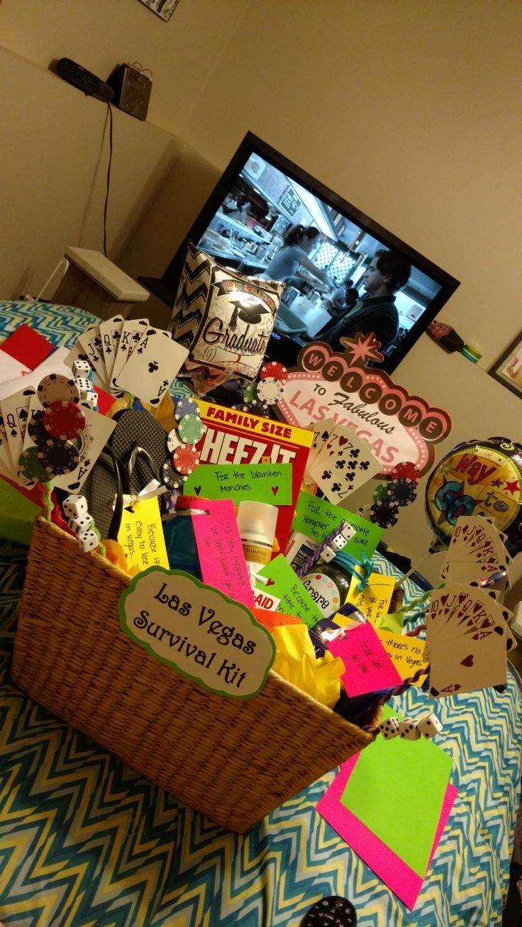 a basket filled with lots of different types of paper and magnets on top of a bed