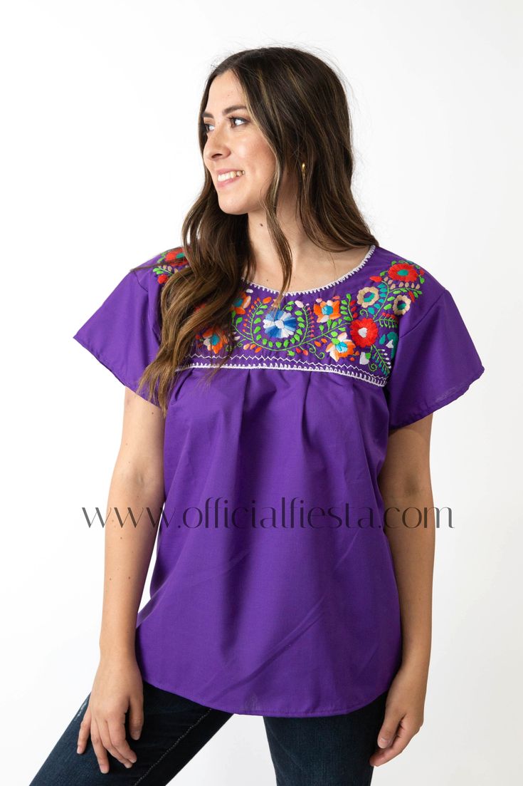 Mexican Embroidered Pueblo Blouse - Purple  These fabulous blouses feature a unique colorful embroidered pattern. These embroidered blouses are also commonly known as Mexican Peasant Blouse Tops.  Please note that each blouse is individually hand embroidered so the embroidery design will vary from the one pictured. You will receive the blouse color selected. Bohemian Purple Blouse With Floral Embroidery, Embroidered Bohemian Purple Blouse, Bohemian Embroidered Purple Blouse, Purple Embroidered Bohemian Blouse, Bohemian Purple Embroidered Blouse, Purple Embroidered Short Sleeve Blouse, Embroidered Fiesta Blouse, Folk Style Blouse For Fiesta, Mexican Peasant Blouse