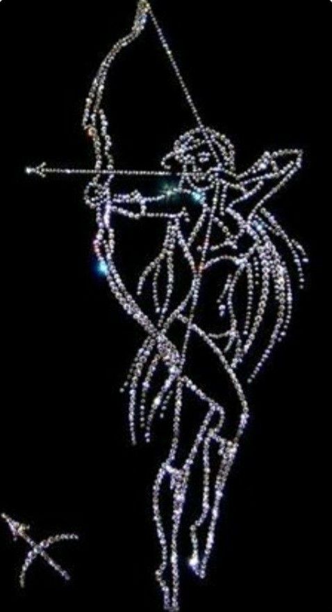 a lit up angel with a bow and arrow