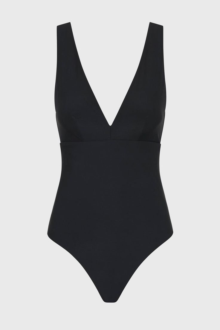 The Lecco One Piece in Black features a flattering, plunge V neck and a supportive, under-bust seam. A classic, minimal swimsuit, Lecco is crafted from our luxury, Italian Sculpteur® fabric﻿, with a patented 3-D stretch that supports and flatters the silhouette. With wide, comfortable shoulder straps and assistance with tummy control, Lecco delivers ease and body confidence. Lecco has regular bottom coverage and is suitable for larger busts up to cup size DD. Fabric sustainably made in Italy.Garment sustainably made in Australia. Elegant Swimsuit, Resort Wear Dresses, Matching Separates, Dd Cup, Luxury Swimwear, Body Confidence, Black Features, Black One Piece, Designer Swimwear