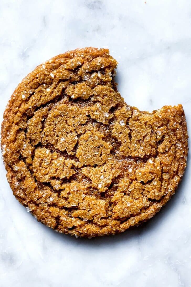 an oatmeal cookie on a marble surface