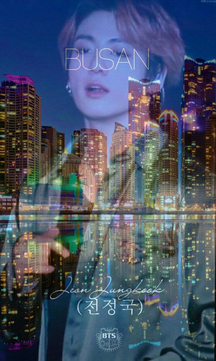 blurry image of a woman holding her cell phone in front of a cityscape