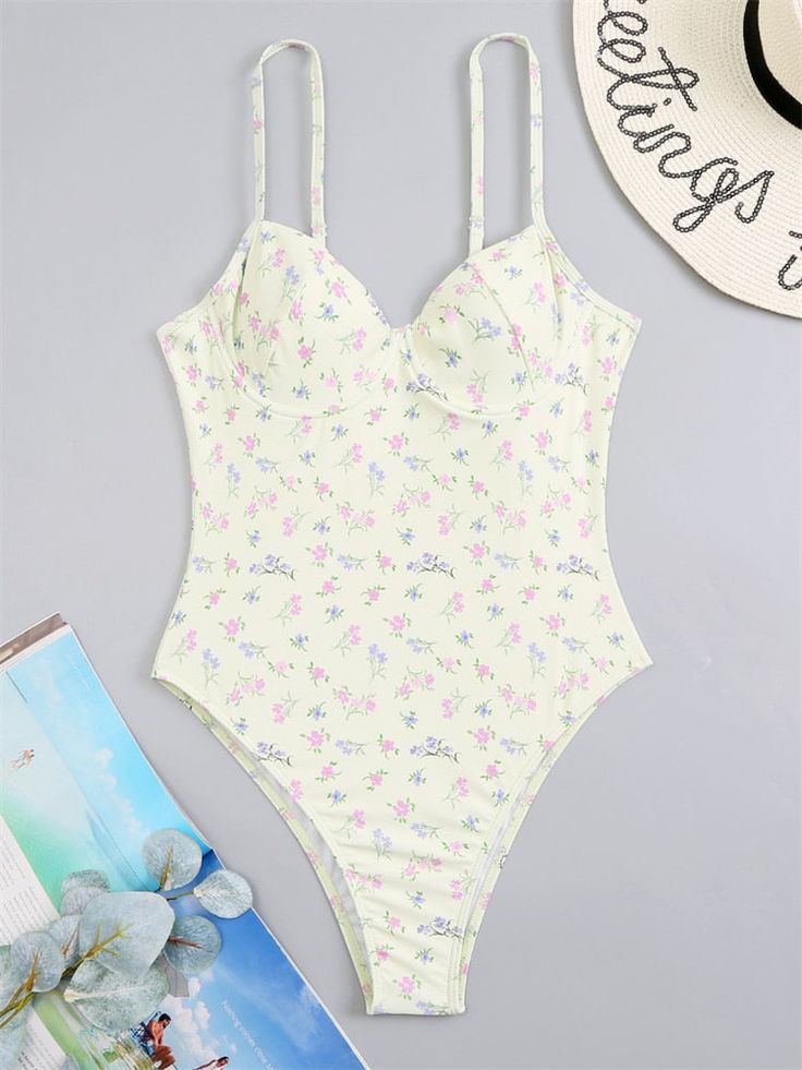 This Absolute Sweetheart Bustier Swimsuit will make you feel gorgeous and confident as you flaunt your style in the sun. Featuring beautiful floral detailing, this swimsuit is sure to turn heads. Underwire Bodysuit With Built-in Bra For Vacation, Summer Poolside Bodysuit With Built-in Bra, Summer Swimming Bodysuit With Built-in Bra, Trendy Swimwear With Built-in Bra For Spring, Summer Bodysuit With Built-in Bra For Vacation, Trendy Floral Print Swimwear For Pool, Summer Beachwear Bodysuit With Built-in Bra, Floral Print Underwire Swimwear, Underwire Floral Print Swimwear