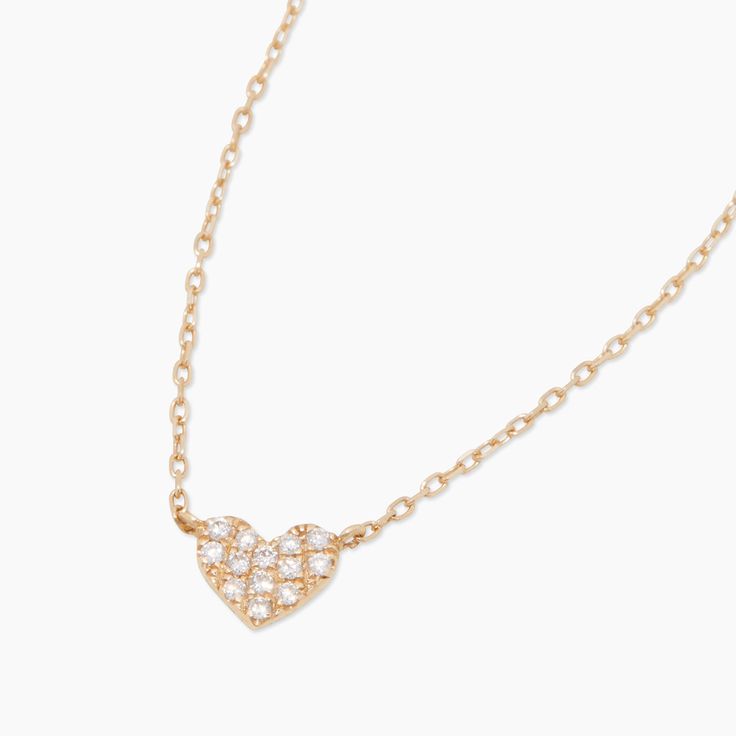 Treat yourself or a loved one to a 14k gold heart necklace that illuminates their neckline with diamonds and love. Product Details 0.65 total carat weight Thirteen .9mm GH SI1 white diamonds 14k gold 15" chain + 2" extender. Adjustable in 1" increments 15" - 17" Heart measures 3/16" Spring ring closure Avoid contact with anything containing derivatives of alcohol | Diamond Pave Heart Charm Necklace in Gold, Women's in 14k gold by Fine Mini Heart Necklace, Heart Charm Necklace, Orange Agate, Yellow Opal, Gold Heart Necklace, Pink Enamel, Mini Heart, Blue Lace Agate, Pink Opal