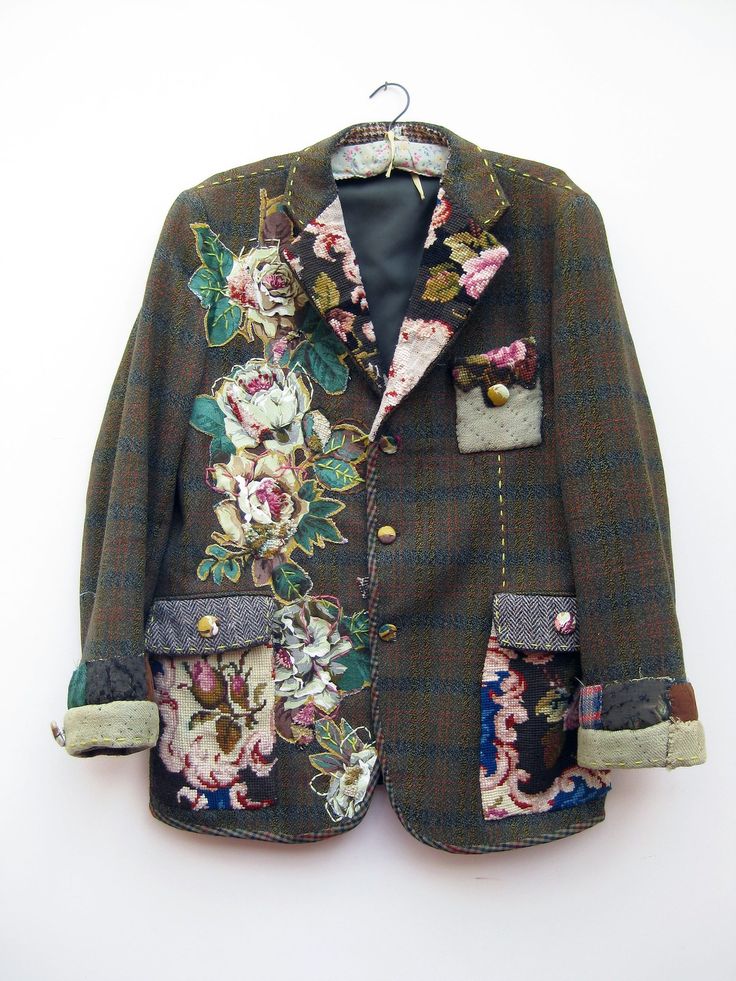 a green jacket with floral designs on it