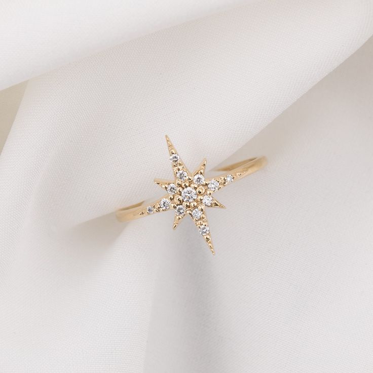 14k solid gold large starburst diamond ring featuring total 0.14ctw white diamonds is available in yellow gold, rose gold, and white gold. Starburst measures approximately 13mmx16mm, it is a large starburst which will be eye-catching for anyone who sees your finger. With carefully handset pave diamond, the ring creates maximum sparkles. * Star size: ≈13mm x ≈16mm * Diamond weight: ≈0.14ctw / G SI1 * Made of 100% recycled precious metal and ethically sourced gemstone * Comes in a gift box with a Celestial Star-shaped Diamond Ring With Single Cut Diamonds, 14k Gold Star-shaped Diamond Ring With Single Cut Diamonds, Celestial Star-shaped Diamond Ring, Star-shaped Single Cut Diamond Ring, Diamond White Star-shaped Diamond Ring, Star-shaped Diamond Rings In White, Star-shaped Diamond Ring With Single Cut Diamonds, Star Shaped Diamond White Rings, Star-shaped Brilliant Cut Diamond Ring