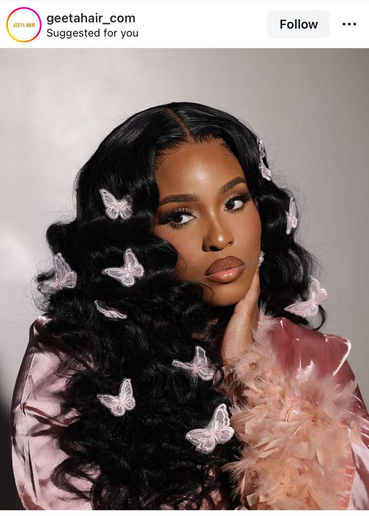 an image of a woman with long hair and butterflies on her head looking at the camera