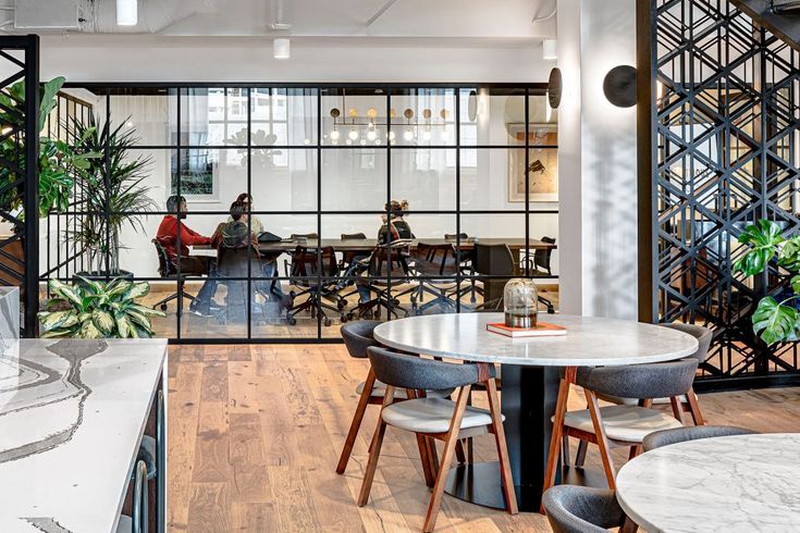 an office with marble tables and chairs