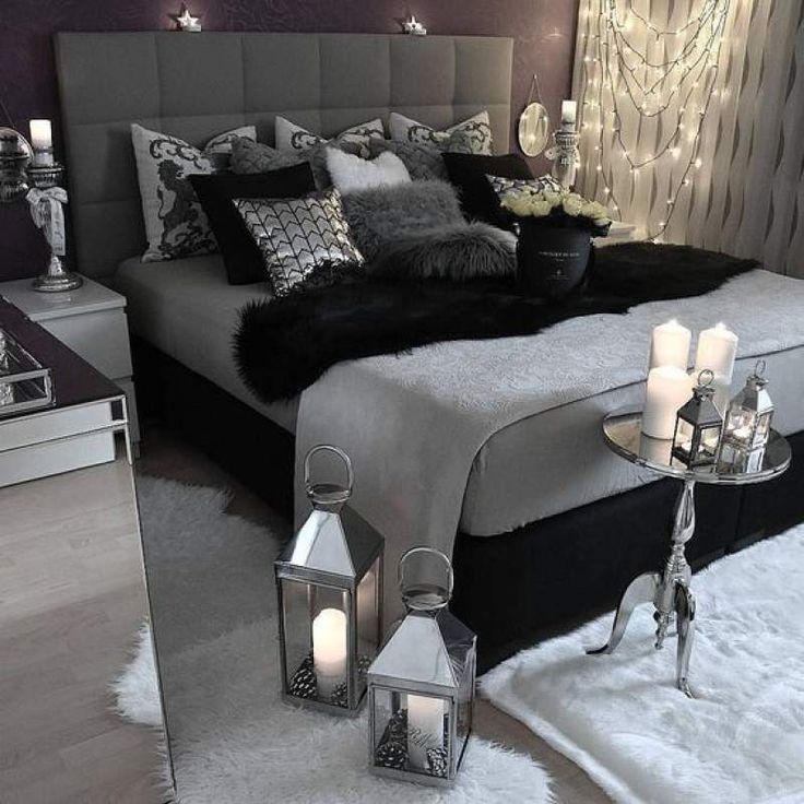 a large bed sitting in a bedroom on top of a white fluffy carpeted floor