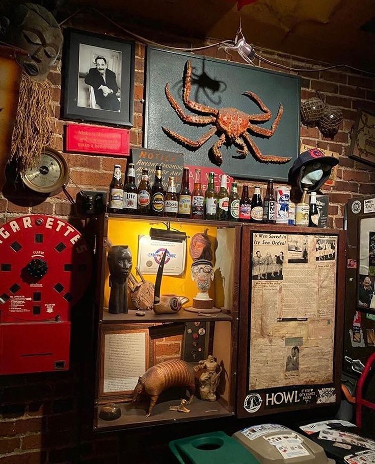 there are many items on the shelves in this room that is decorated with pictures and memorabilia