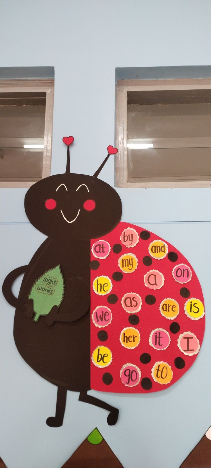 a very cute ladybug shaped bulletin board